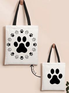 two black and white bags with paw prints on them, one has a dog's paw