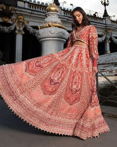 Red modern Lehenga Set, adorned with intricate hand embroidery on raw silk and velvet. The vibrant red hue enhances its allure, while the net blouse features an Indian "Koti" silhouette and European-inspired puff sleeves in raw silk.From Jigar Nikita’s 11:11 In Paris collection DELIVERY TIMEPlease allow 8-12 weeks for your outfit to arrive. FABRIC DETAILSLehenga - Raw Silk & Velvet Blouse - Net and Raw Silk, Dupatta - Net Professional cleaning only. Red Anarkali Lehenga With Long Sleeves, Bohemian Long Sleeve Lehenga For Festive Occasions, Bohemian Long Sleeve Lehenga For Party, Bohemian Style Hand Embellished Wedding Sets, Bohemian Hand Embellished Wedding Set, Bohemian Wedding Sets Hand Embellished, Red Hand Embellished Anarkali Dress, Hand Embellished Red Anarkali Dress, Red Hand Embellished Anarkali Set