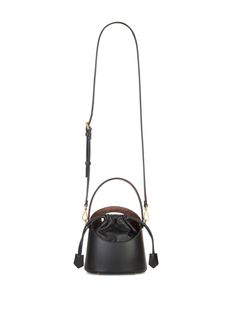 Saturno leather bucket bag from ETRO featuring black, lambskin, cotton lining, cut-out detailing, tonal stitching, bucket body, embossed logo to the front, single flat top handle, adjustable detachable shoulder strap, top drawstring fastening, main compartment, internal logo patch and internal slip pocket. Size Info UNI Color Detail Black Made In Italy Material Calf Skin 100% Season One Fall-Winter Season Two Fall-Winter Product bags.. Brand Etro Size And Fit Width 7,09 in / 18 cm Height 7,28 in Designer Bucket Bag With Detachable Strap And Top Handle, Designer Bucket Hobo Bag With Detachable Handle, Designer Bucket Hobo Bag With Removable Pouch, Designer Hobo Bucket Bag With Removable Pouch, Designer Bucket Hobo Bag With Leather Handles, Black Calf Leather Top Handle Bucket Bag, Designer Black Bucket Bag With Double Handle, Black Leather Bucket Bag With Top Carry Handle, Luxury Black Calf Leather Bucket Bag