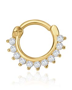 a gold nose ring with small white stones on the outside and an open circle in the middle