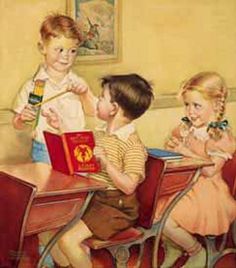 three children sitting at a table with books and drinks in front of them, one holding a book