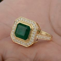 Genuine Square Emerald Ring/ 14K Solid Gold Statement Ring/ Emerald Diamond Halo Ring/ Emerald Engagement Ring/ Certified Handmade Ring ≫ Features * item code: SR01754 * Diamond: 100% Genuine Diamond * Diamond Wt: 0.66 Ct. * Diamond Color: G-H * Diamond Clarity: S2-SI1 * Diamonds Cut: Brilliant Cut (Excellent Cut) * Emerald Gemstone Wt.:- 4.75 Ct. * Metal: 14K Solid Gold (18K also available - Additional fees may apply) * More options in gold color: Rose gold, yellow gold, White gold * Ring Size: Gia Certified 14k Gold Cluster Ring, Luxury Gold Halo Ring With Gemstone, Gia Certified Gold Halo Ring, Gold Halo Ring With Gemstone In 14k Gold, Luxury Gold Emerald Ring With Halo Setting, Gia Certified Yellow Gold Emerald Cut Halo Ring, Gia Certified Emerald Cut Yellow Gold Halo Ring, 14k Gold Gia Certified Emerald Ring Gift, Luxury 14k Gold Emerald Ring With Halo Setting