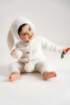 SET OF 2!  This listing for romper and bunny bonnet! CARROT NOT INCLUDED IN THIS LISTING Care: Hand wash in cold soapy water, lay flat to dry. Yarn: 71% alpaca, 25% wool, 4% polyamide Pom poms: genuine fur Pom poms can be made in beige or light yellow colour.  Thank you for visit my shop! Cute White Easter Outfit Set, Cute White Easter Sets, Baby Bunny Outfit, Roblox Ids, Easter Bunny Outfits, Bunny Bonnet, Bunny Outfit, Baby Bonnets, Baby Girl Boy