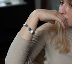 Gorgeous and sophisticated hand-crafted and hammered cuff bangle in Silver or 18ct Gold Vermeil. A beautiful statement piece, easy to wear every day. An exquisite example of true artisan craftmanship, these bangles bear the hallmarks of hands and are each completely unique. HAMMERED OPEN CUFF BANGLE DETAILS The bangle is available in Sterling Silver, 18ct Gold Vermeil All raw materials/gemstones are ethically sourced. SIZE The Bangle is 10mm wide. The size of the circumference of a standard bang Formal Hammered Cuff Bracelet, Modern Hammered Bangle Bracelets, Minimalist Engraved Bangle Cuff Bracelet, Elegant Hammered Cuff Bracelet As Gift, Elegant Hammered Cuff Bracelet Gift, Formal Hammered Cuff Bracelets, Modern Hammered Cuff Bangle, Hammered Bracelets For Anniversary, Minimalist Hammered Cuff Bangle Bracelet