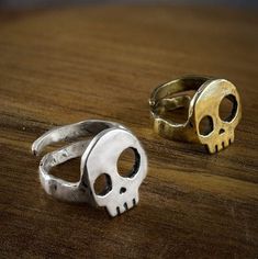 "Ajustable Skull ring This skull ring is a funny and casual skull adjustable ring in silver or golden brass. Tired of the clasic skull ring we've tried to do something diferent from the high detailed and heavy anatomical rings. It is melted, carved by hand and with a high quality finision. The adjustable skull ring is exclusively designed and sell in our shop. It is a funny design with asymmetrical eyes which makes you feel cool and awesome. The concurrent back in the ring allows a double functi Asymmetrical Eyes, Birthday Cake Smash, Iron On Vinyl, Skull Ring, Adjustable Ring, Adjustable Rings, Funny Design, Rings For Men, Ring Size