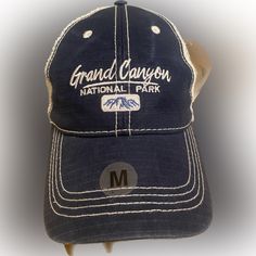 Elevate Your Style With This Navy Blue Snapback Hat Featuring The Stunning Grand Canyon National Park Embroidered On The Front. Made By Prairie Mountain, This Hat Is Perfect For Travel And Casual Wear. The Breathable Mesh Back And Adjustable Snap Closure Make It Comfortable To Wear All Day. Does Have Discoloration On Top Left Side Of Bill, Shown In Pictures. Does Still Have Tag On Item! Navy Casual Hat For Outdoor Activities, Navy Travel Cap, Casual Navy Hat For Outdoor Activities, Blue Flat Brim Hat With Letter Print, Casual Blue Hat For Travel, Blue Curved Brim Baseball Cap For Travel, Casual Blue Snapback Hat For Travel, Travel Blue Curved Brim Baseball Cap, Blue Flat Brim Hat For Travel