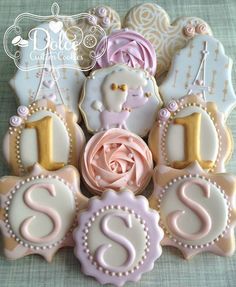 decorated cookies are arranged in the shape of letters