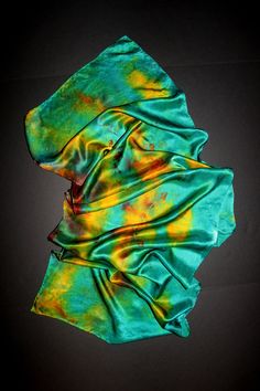 Hand dyed silk satin scarf Dear visitors, please note The scarves are washable, as it has been drawn with special fabric paint. They never get discolored or change color, if you take care right way. Here is some information. Originally white silk has been dyed and painted to other colors, that`s it can be a little thick (hard). Care instruction * Place your silk scarf in warm water with a mild silk-friendly detergent. * Leave to soak (no more than 5 minutes). * Rinse with warm water * To help ke Multicolor Hand Dyed Silk Scarves, Bohemian Hand-dyed Silk Scarf, Handmade Artful Silk Scarves, Artistic Hand Dyed Green Silk Scarf, Bohemian Silk Scarf For Artistic Expression, Hand Painted Green Silk Scarf, Artistic Hand Dyed Silk Scarves, Artistic Hand-dyed Silk Scarves, Artistic Hand-dyed Green Scarves