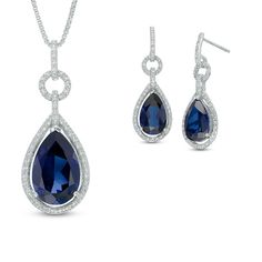 Treat her a look she'll adore with this eye-catching pendant and earring set. Fashioned in sleek sterling silver, the pendant features a lovely 14.0 x 9.0mm pear-shaped, lab-created bright blue sapphire center stone. A border of shimmering round diamonds surrounds the center stone, while the diamond-lined bridge and bail are thoughtful touches. The drop earrings follow the same enchanting design. A lovely coordinated look, the pendant suspends along an 18.0-inch box chain that secures with a spr Sterling Silver Pendant Jewelry Set For Formal Occasions, Sapphire Cubic Zirconia Jewelry Sets, Sapphire Sterling Silver Fine Jewelry Sets, Sapphire Sterling Silver Jewelry Sets, Fine Jewelry Sets In Sapphire Sterling Silver, Sterling Silver Pendant Jewelry Sets, Sterling Silver Jewelry Sets With Drop Earrings, Fine Jewelry Set With Pendant And Matching Earrings, Fine Jewelry Sets With Matching Earrings And Pendant