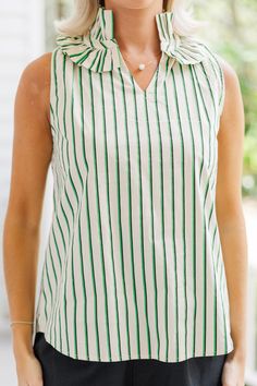 Say hello to our green striped tank blouse with a charming ruffled neckline! This sleeveless blouse is perfect for achieving a chic and put-together summer look. Pair it with trousers or trouser cut shorts for an effortlessly stylish outfit. You'll love how fresh and elegant you feel in this versatile and fashionable top!
V-neckline
Ruffled detailing
Sleeveless cut
Striped print
No stretch
Payton is wearing the small. Cut Shorts, Bold Outfits, Floral Cocktail Dress, Black Tie Dress, Girl's Back, Ruffled Neckline, Mint Julep Boutique, Cute Boutiques, Cute Rompers