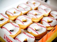 a box filled with donuts covered in white frosting