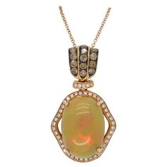 Custom Le Vian Opal and Diamond Pendant crafted in 18k gold. Designer: Le Vian Gemstone: Neopolitan Opal Gemstone Weight: Approximately 5.89CT Diamond Carat Weight: Approximately .75CTW Diamond Cut: Round Brilliant; Average G-J Color and 13 Brown in color Clarity: Average SI1-SI2 Metal: 18K Strawberry Gold Marked/Tested: Stamped "LeVian 18K" Weight: 18.1 Grams Chain Length: 18” Long Pendant Length: Approx. 1.25” Long Victorian Pendant Necklace, Victorian Pendants, Compass Pendant, 18k Gold Necklace, Heart Necklace Diamond, Le Vian, Diamond Eyes, Pave Pendant, Drop Pendant Necklace