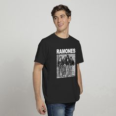 a man standing in front of a white wall wearing a black ramons t - shirt