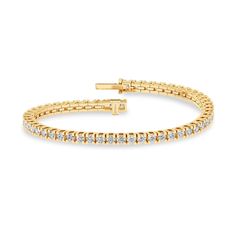 The Essential Tennis Bracelet exemplifies the magnificence of your beauty. Its string of glistening diamonds radiates luxury from every angle, and its minimalistic design makes you shine in all your glory. The diamond bracelet has a secured top GB lock that ensures the bracelet is secured and feels comfortable. Formal Yellow Gold Diamond Bracelet With Brilliant Cut, Formal Yellow Gold Diamond Bracelet With Prong Setting, Everyday Luxury Flexible Diamond Bracelet, Classic Flexible Tennis Bracelet With Round Cut, Timeless Flexible Tennis Bracelet For Anniversary, Classic Flexible Diamond Bracelet, Classic Gold Bracelet With Brilliant Cut For Formal Occasions, Yellow Gold Diamond Bracelet With Jubilee Design, Classic Flexible Cubic Zirconia Diamond Bracelet