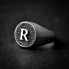 A handmade sterling silver 925 round letter signet ring set with black zircons.Each ring is cleaned and polished with care.The weight of the ring may vary according to size.Aprrox weight: 4.52grRing Hight: 13mmThe ring is made of sterling silver 925 and is water resistant.The ring is set with black zircons and can be made with any letter from A-Z.If you have any further questions, please don’t hesitate to contact us.Back to the store >>> https://www.etsy.com/il-en/shop/NADesignsStoreMak Silver Monogram Signet Ring, Luxury Silver Monogram Initial Ring, Luxury Silver Initial Ring With Monogram, Luxury Silver Signet Ring With Monogram, Luxury Silver Monogram Signet Ring, Luxury Silver Signet Ring With Initials, Luxury Silver Personalized Signet Ring, Luxury Personalized Silver Signet Ring, Black Personalized Sterling Silver Signet Ring