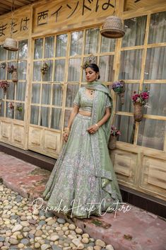 Sage Green Organza Lehenga with Silver Embroidery Embrace the elegance of the Ruhani Collection with this Sage Green Organza Lehenga from Panache Haute Couture. The lehenga features intricate silver embroidery beautifully accented with pink floral motifs, making it an ideal choice for brides seeking a blend of modern charm and traditional luxury. The lightweight organza fabric offers a graceful flow, perfect for weddings, receptions, or festive events. Designed for the fashion-forward bride, this exquisite piece is a testament to fine craftsmanship and timeless beauty. Elevate your bridal look with this stunning sage green lehenga, ideal for making a memorable statement. Brand: Panache Haute Couture Collection: Ruhani Lehenga Name: Adara Availability: Online and In-store Fabric: Full Set : Green Organza Lehenga, Green Color Wedding, Green Bridal Lehenga, Pastel Lehenga, Floral Lehenga, Organza Lehenga, Indian Wedding Outfit, Weddings Receptions, Sage Green Color