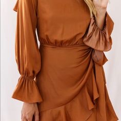 Flowy Camel Colored Wrap Dress. Open Back For Flirty Fun! Chic Brown Mini Dress With Ruffles, Brown Long Sleeve Dress For Date Night, Long Sleeve Brown Dress For Day Out, Long Sleeve Brown Dresses For Day Out, Brown Mini Dress For Brunch, Chic Brown Mini Dress For Brunch, Brown Long Sleeve Dresses For Brunch, Brown Long Sleeve Dress For Brunch, Brown Mini Dress For Spring Date Night