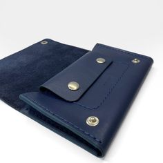 Trucker wallet is slim style with a card slot and coin purse with a metal silver buttons. Made of soft dark blue leather. * Composition: 100% leather * Dimensions: Width: 16 cm (6.3 inch) Height: 9.5 cm (3.7 inch) Depth: 1,2 cm (0.5 inch) Modern Blue Wallets For Gift, Blue Leather Wallets For Daily Use, Blue Leather Trifold Wallet With Card Slots, Blue Leather Trifold Wallet For Travel, Blue Wallets With Coin Pocket For Daily Use, Blue Leather Wallet With Coin Pocket, Leather Wallets With Snap Closure For Gift, Leather Wallet With Snap Closure As Gift, Leather Wallets With Snap Closure As Gift