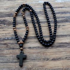 Black Onyx Cross & Rosewood Necklace Black Spiritual Cross Jewelry, Spiritual Black Cross Jewelry, Black Cross Jewelry With 8mm Beads, Adjustable Spiritual Crucifix Cross Necklace, Adjustable Spiritual Cross Necklace, Spiritual Crucifix Necklace With 8mm Beads, Black Adjustable Crucifix Necklace, Adjustable Black Crucifix Necklace, 108 Bead Cross Jewelry For Meditation