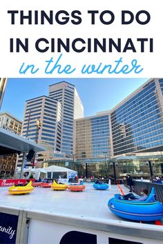 an ice rink in the middle of a city with text overlay that reads things to do in cincinnati in the winter