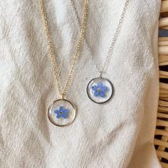 This Forget Me Not Necklace showcases delicate dried blue flowers. Expertly crafted with the finest materials, this necklace features a high-quality resin pendant that is durable and lightweight, ensuring maximum comfort during wear. The inclusion of dried blue flowers adds a touch of natural beauty and serves as a poignant reminder of the preciousness of life. This Necklace is a true testament to the values of brotherhood, loyalty, and fidelity at the heart of Masonic symbolism. They are perfec 2000s Jewelry, Plant Style, Floral Necklace, Crystal Drop Earrings, Resin Pendant, Forget Me Not, Blue Crystals, Necklace Gift, Resin Jewelry