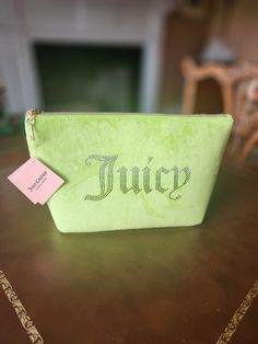 Beautiful lime green JUICY COUTURE travel cosmetic bag Rhinestones logo accent . Ombre rhinestones  Gold tone hardware  Zipper around closure  Pink lining inside Soft velvet material  Large makeup bag Measurements: 10"×8"×4.5" Great holidays gift idea  Spoil yourself and shine! Fashionable statement to your fabulous look ❤️ ✨️ Juicy Makeup Bag, Tj Maxx Purses, Green Juicy Couture, Big Makeup, Makeup Purse, Large Makeup Bag, Steve Madden Purse, Bag Measurements, Couture Bags