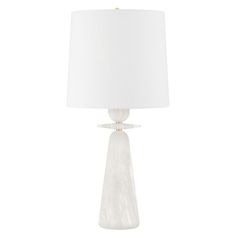 a white table lamp with a white shade on it