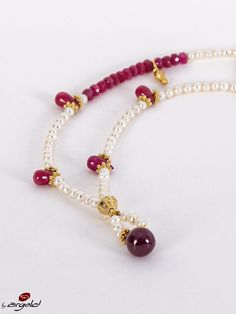 Introducing our handmade beaded necklace, crafted with a stunning combination of Ruby, Drop Ruby, and Freshwater Pearl beads. This beautiful piece of jewelry is sure to turn heads and add a touch of elegance to any outfit. Each bead has been carefully selected and handcrafted to create a one-of-a-kind necklace that is both unique and timeless. The deep red hues of the Ruby and Drop Ruby beads contrast beautifully with the creamy iridescence of the Freshwater Pearl beads, creating a truly captivating color palette. The necklace is approximately 17 inches long, and the beads are strung together with a durable, yet delicate-looking wire that allows for a comfortable fit. The necklace is finished with a secure lobster clasp that ensures it stays in place throughout the day. This handmade beade Handmade Pearl Necklace With Round Beads For Festive Occasions, Handmade Festive Pearl Necklace With Round Beads, Elegant Single Strand Beads For Jewelry Making, Elegant Pearl Spacer Beads, Elegant Double Strand Faceted Beads, Elegant Hand-strung Long Beaded Necklace, Elegant Long Hand-strung Beaded Necklace, Faceted Beads Pearl Necklace For Jewelry Making, Round Faceted Beads Pearl Necklace For Jewelry Making