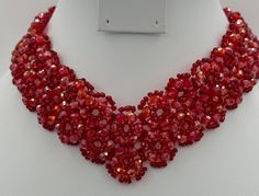 Scarlet Red mesh, woven necklace.  Faceted red beads, gold tone fold over closure.  15" L,  1.5" w, bows and heart shaped gold tone closure. 3 oz. Valentine's Day Beaded Party Necklace, Valentine's Day Costume Jewelry Necklaces For Parties, Elegant Handmade Beaded Necklaces For Valentine's Day, Elegant Handmade Beaded Necklace For Valentine's Day, Handmade Red Necklace For Evening, Elegant Beaded Necklaces For Valentine's Day, Handmade Choker For Valentine's Day Party, Elegant Red Bib Necklace For Party, Valentine's Day Elegant Beaded Necklaces