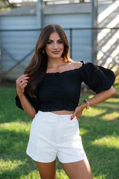 Embrace effortless style with our Emmy Puff Sleeve Top in black. The versatile sleeves can be worn on or off the shoulder, while the puff sleeves and ruffled trim add a touch of femininity. Made from smocked crinkle material, this cropped top offers a flattering fit for any occasion. 100% cotton Model is 5'3" with a 32" bust, 25" waist, and 38" hips wearing a size small Loungewear Summer, Dresses By Length, Puff Sleeve Top, Short Rompers, Cropped Top, Puff Sleeves, Set Dress, Effortless Style, Dresses For Sale