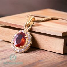 Hessonite Garnet stone brings calmness, clarity of thought, and boosts the self-confidence of the wearer.  The cavity is made from 925 Sterling silver. Stone Name - Natural Hessonite Garnet Secondary Stone - Zircon Metal - 925 Sterling Silver Stone Size - 8 x 6 MM Stone Shape - Oval Faceted Pendant Length - 12 MM Pendant Width - 20 MM Pendant Weight - 1.80 Grams Approx *Chain -: Metal - 92.5 Sterling Silver Chain Type - Curb Chain Thickness - 2 MM Chain Length - 16, 18 Inch Weight: 2.50 gram (18 Oval Pendant Halo Jewelry For Gift, Halo Oval Pendant Jewelry As Gift, Wedding Garnet Cabochon Jewelry, Formal Oval Garnet Pendant Jewelry, Anniversary Cabochon Garnet Jewelry, Anniversary Garnet Oval Cabochon Jewelry, Red Gemstone Jewelry With Square Pendant, Hessonite Garnet, Garnet Pendant