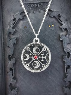 This Sigil of Decarabia necklace is an handmade pewter sculpture with a gem of your choice (my favorite is the red abalone, if you are looking for a very nice bloody red) This seal of Decarabia is one of the 72 Sigils of Goetia from Ars Goetia's Demonology This Sigil of Goetia pendant is sold with a free 18'' stainless steel chain, if you would like to have a different length for the chain, you can write the desired length in the private note section when ordering :) This Seal of Decarabia is a Antique Silver Hand Cast Necklaces For Gift, Gift Antique Silver Hand Cast Necklaces, Gothic Necklace With Oxidized Finish As Gift, Antique Silver Hand Cast Necklace As Gift, Gothic Oxidized Necklace As Gift, Symbolic Pewter Jewelry As Gift, Symbolic Pewter Jewelry For Gifts, Red Necklace With Oxidized Finish For Gift, Antique Silver Hand Cast Necklace For Gift