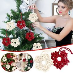 a woman is decorating a christmas tree with red and white flowers on it's branches