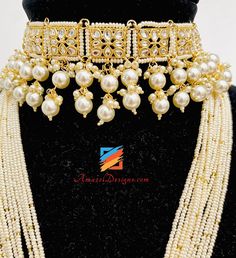 Fine Beads Lightweight Flexible Golden Kundan Long Mala Rani Haar With Choker Jhumki Earrings Tikka set. - Available to be shipped for FREE from Canada to US, Canada, Australia, New Zealand, Norway, Europe and everywhere else. Explore more BRIDAL SETS, INDIAN JEWELRY SETS 📦 Unmatched FREE Worldwide Shipping ⭐️⭐️⭐️⭐️⭐️ 5 Star Customer Reviews Rajveer, Canada ⭐️⭐️⭐️⭐️⭐️ I bought chokkar set from this website. I really loved the set and couldn’t express my feelings when I opened the box with thank Pearl Beaded Jewelry For Diwali, Diwali Beaded Pearl Jewelry, Festive Pearl Jhumkas, Traditional White Pearl Set, Festive Pearl Sets As Gifts, Festive Pearl Sets For Gift, Traditional White Kundan Necklace With Dangling Beads, Bollywood Style Jewelry With Dangling Beads For Diwali, Bollywood Beaded Jewelry Sets For Festive Season