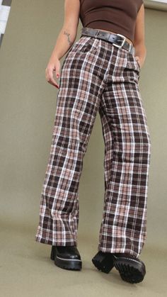 The Plaid Straight Leg Pants in Brown are a classic and stylish addition to your wardrobe. The brown color adds warmth and versatility, making them a fantastic choice for pairing with various tops, from cozy knit sweaters to chic blouses, for a fashionable and comfortable looks. Plaid pants Straight leg Button waistline Zipper closure Fabric: 100% Polyester Inseam: Rise: Small: 29.75 Small 12.25 in Medium 30 in Medium 12.50 in Large 30.25 in Large 13 in Model Specs: Emily is wearing a size small Cozy Knit Sweater, Everyday Chic, Chic Blouses, Plaid Pants, Pants Straight, Chic Boutique, Cozy Knits, Straight Leg Pants, Brown Color