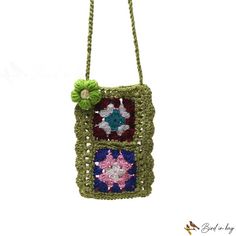 a crocheted purse hanging from a string