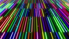 an image of colorful lights in the night sky with stars and lines coming out of them