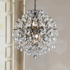 a chandelier hanging from the ceiling in a room