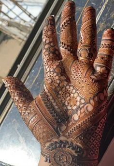 the hand is decorated with intricate designs