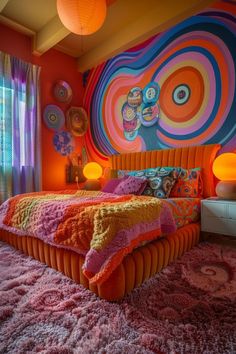 a colorful bedroom with an orange bed and pink rugs on the floor in front of a large painting