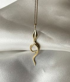 This snake pendant has the perfect size for everyday wear, with a length of approx 4 cm. It comes on a chain in either 40 or 45 cm length. The pendant and chain is crafted in either 24 ct gold plated sterling silver or 9 ct solid gold. Many off my pieces are in stock, however all pieces are handmade and could take up to 2-4 weeks for production and shipping. Please feel free to get in contact for inquires about the stock levels of specific items. If you need something for a specific date please let me know and I will do my best to accommodate you where possible. Gold Jewelry With Large Pendant On Snake Chain, Elegant Gold Plated Snake Shape Necklace, Gold Snake-shaped 14k Gold Necklace, Gold Snake Shape 14k Gold Necklace, Yellow Gold Brass Snake Chain Necklace, Yellow Gold Chain Necklace With Large Pendant For Gift, Yellow Gold Brass Necklaces With Snake Chain, Yellow Gold Brass Snake Chain Necklaces, Gold Plated Snake Necklace