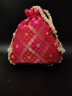 "traditional indian wedding delicate gota patti embroider gifting potli bag giveaways | rani pink drawstring purse with beaded chain Package Contents: 1 Size: 10\" x 8\" Designed with the heart, this beautiful Potli or batawa bag are eye catchy and made of premium material. Key Features: Embroidery art work. This potli is good match with both Indian and western outfits and are superb for wedding and festive parties. This would be best complement to your designer saree, lenhga or any other kind o Festive Pink Embroidered Pouch, Festive Embroidered Pink Pouch, Traditional Pink Pouch For Festive Occasions, Traditional Pink Pouch For Festive Season, Festive Pink Potli Bag For Party, Red Potli Bag With Zari Work For Diwali, Red Zari Work Potli Bag For Diwali, Pink Handwork Potli Bag For Diwali, Red Zari Work Potli Bag For Party