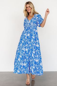 Elaine Maxi Dress | Blue + White V-neck Beach Dress With Elastic Waistband, Blue V-neck Maxi Dress With Smocked Back, V-neck Maxi Dress With Elastic Waistband For Day Out, Summer Maxi Dress With Elastic Waistband And V-neck, Summer Maxi Dress With V-neck And Elastic Waistband, Blue Floral Print Empire Waist Dress, Blue Empire Waist Dress With Floral Print, Casual V-neck Maxi Dress With Elastic Waistband, Blue Breezy Maxi Dress With Smocked Back