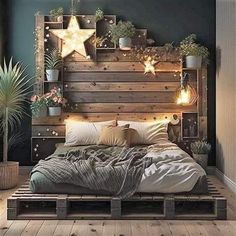 a bed made out of wooden pallets with plants and lights on the headboard