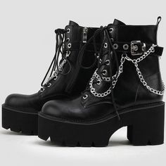 Description:Step into a rock-punk style and comfort this season with the exaggerated platform booties. Made of PU leather and thermoplastic rubber, embellished with metallic detailing embodied with an adjustable buckle closure and layered chains, featuring a round closed toe framed by a faux leather upper, a lightly cushioned footbed anchored by a shock-absorbing ridged outsole, an ankle-length shaft dotted with a lace-up fastening and silver-tone eyestays, a chic platform structured with a rubber block heel. Find more trendy women's platform boots and unique shoes in our boutique, and pair the lace-up boots well with a slashed mini dress and a cropped cardigan for a stylish street look - Heel height: 8cm. Size Length(in) Length(cm) 35 8.86 22.5 36 9.06 23 37 9.25 23.5 38 9.45 24 39 9.65 2 Gothic Leather Combat Boots With Platform, Punk Style Martin Boots With Platform, Punk Style Martin Boots With Platform And Round Toe, Punk Style Platform Moto Boots For Fall, Edgy Fall Platform Boots For Concert, Gothic Leather Boots With Chunky Platform, Gothic Platform Martin Boots For Fall, Winter Platform Martin Boots For Concerts, Winter Concert Platform Martin Boots