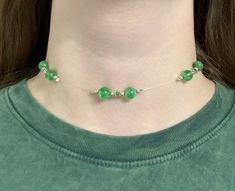 "I've been waiting to create this beautiful choker! It's certainly one of a kind. The beads on this choker are 8mm Green beads (glow-in-the-dark), and 3mm bicone green beads. This choker is 14\" but you can also choose whether or not you'd like a 3\" extender for it. (It costs $1.50 extra for the extender) It usually takes me 1-3 days business days to process your order. Depending on where you live, it will take around 1-4 weeks to have your order shipped to you. As always, thanks in advance!" Elegant Choker, Floral Scrunchie, Beautiful Chokers, Green Beads, Choker Necklaces, Green Bead, How To Make Beads, Chain Styles, Glow In The Dark