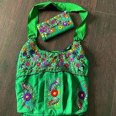 Totally Handmade Embroidery By Indigenous From Oaxaca Mexico Everyday Use Green Shoulder Bag With Floral Embroidery, Spring Green Floral Embroidered Shoulder Bag, Green Embroidered Shoulder Bag For Festivals, Bohemian Green Bag With Floral Embroidery, Everyday Embroidered Wallets, Green Traditional Bag With Floral Embroidery, Traditional Summer Shoulder Bag With Floral Embroidery, Embroidered Wallets For Daily Use, Summer Green Bags With Floral Embroidery