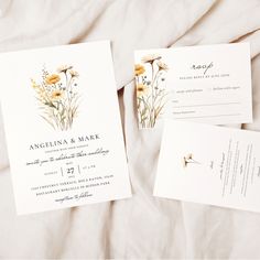 two wedding cards with flowers on them