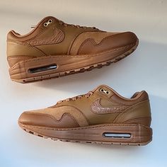 The Nike Air Max 1 ’87 Luxe “Ale Brown” Consists As A Premium Iteration Of The Iconic Runner And It’s Slated To Debut Next Month. Perfectly Styled To Suit Fall, The Model Flaunts An Official Color Scheme Of “Ale Brown/Ale Brown-Gum Medium Brown” Across Its Suede, Leather, And Mesh Composition Which Also Bears A Textured Vamp And Swooshes On Its Side Panels. Finally, The Earthy Makeup Boasts Tonal Branding, Followed By Gold Upper Eyelets And Lace Tips For Luxe Flair, All While Resting Atop A Gum Nike Air Max Leather With Cushioned Footbed, Nike Air Max With Boost Midsole In Leather, Nike Air Max With Boost Midsole And Leather Material, Nike Air Max With Leather And Boost Midsole, Custom Brown Leather Sneakers With Air Max Cushioning, Leather Custom Sneakers With Air Cushioning For Streetwear, Nike Air Max Leather Lace-up, Nike Air Max Sporty Leather Shoes With Round Toe, Nike Air Max Leather Lace-up Shoes