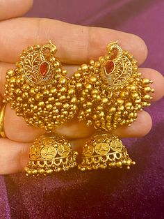 These Antique Peacock Earrings are a must-have for any fashion-forward individual. Each pair boasts intricate designs and is available in four stunning colors. Perfectly complement any Indian outfit with these unique earrings. Length - 6 cm Jewellery Care- Keep the jewelry dry, avoid heat and contact with perfumes & water. Ornate Red Earrings For Festivals, Chandbali Danglers With Peacock Design, Elegant Peacock Design Jhumkas For Party, Peacock Design Dangle Chandelier Earrings, Gold Peacock Design Chandelier Earrings Gift, Gold Chandelier Earrings With Peacock Design As Gift, Elegant Peacock Design Earrings For Festive Occasions, Red Peacock Design Earrings For Gifts, Gold Chandelier Earrings With Peacock Design For Festivals